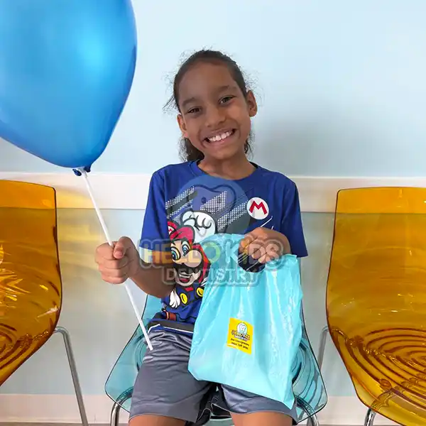 Happy child during a pediatric dental visit at Hello Kids Dentistry in Pembroke Pines, Florida