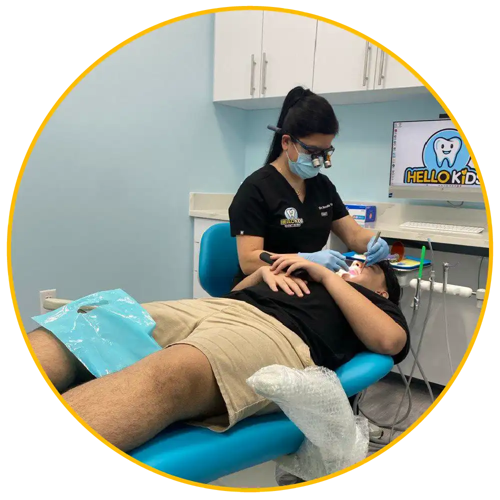 Child with tooth pain receiving pediatric dental emergency care at Hello Kids Dentistry in Pembroke Pines Florida.