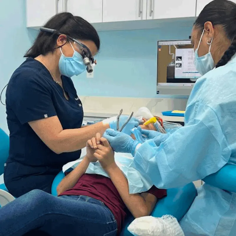 Dr. Roula Yazaji providing gentle dental treatment to a child at Hello Kids Dentistry Pembroke Pines FL